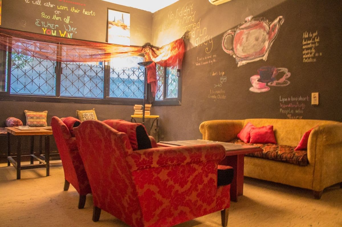 Colourful armchairs and chalkboard walls in The Tipsy Teapot Lounge, one of Ally's venues